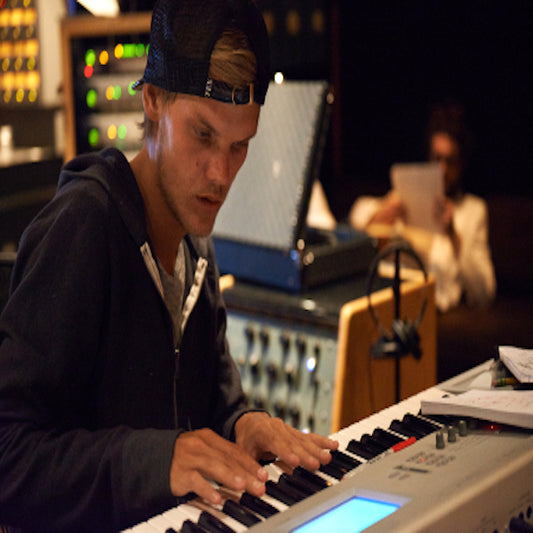 Famous DJ/Producer, Avicii, working in a recording studio.